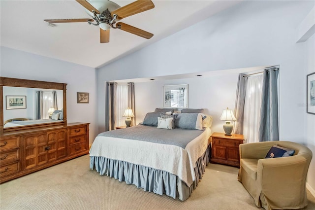 bedroom with lofted ceiling, light colored carpet, and a ceiling fan