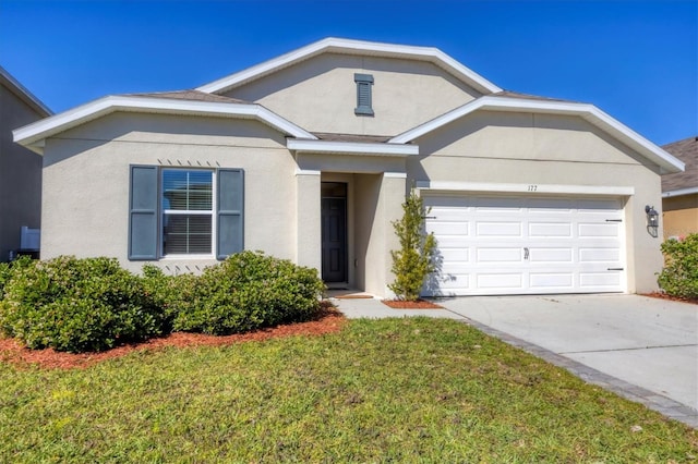 single story home featuring stucco siding, driveway, a front yard, and a garage