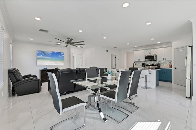 dining area featuring arched walkways, visible vents, marble finish floor, and crown molding