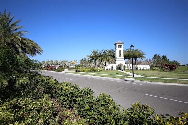 view of road featuring sidewalks and street lighting