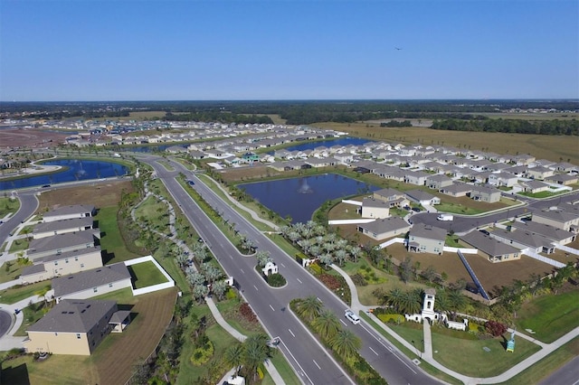 aerial view featuring a residential view and a water view