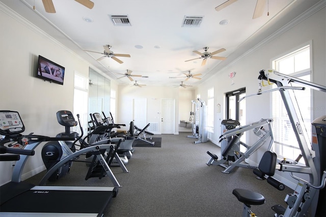 workout area with ceiling fan, baseboards, visible vents, and ornamental molding