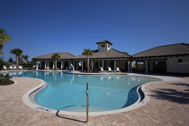 community pool featuring a patio