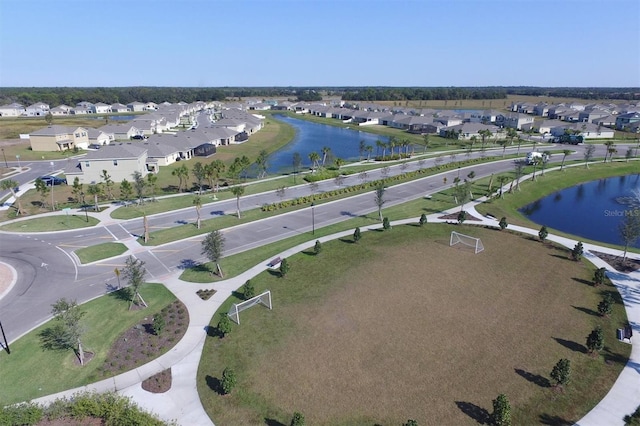 birds eye view of property featuring a residential view and a water view