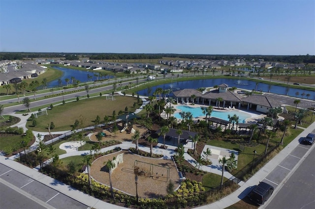 birds eye view of property with a water view