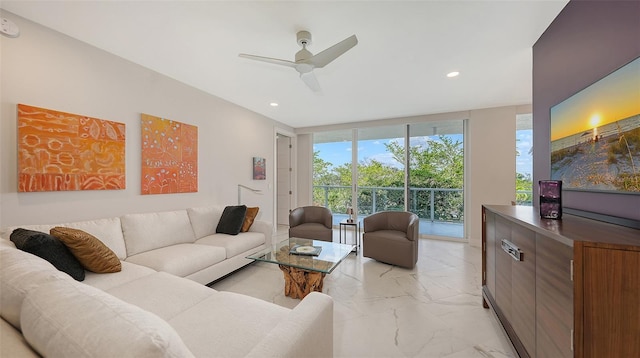 living room with marble finish floor, floor to ceiling windows, a ceiling fan, and recessed lighting