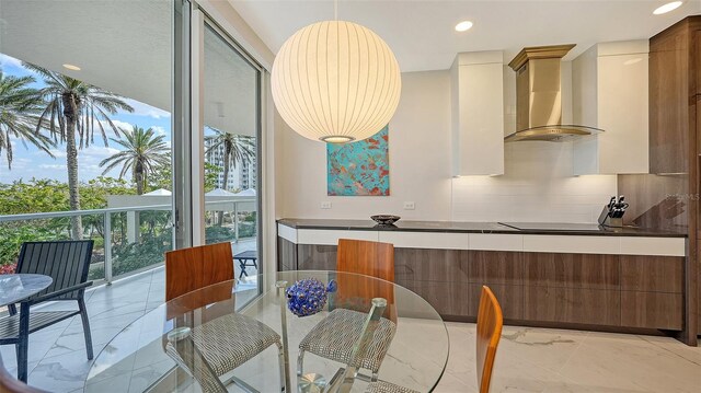 dining area with recessed lighting, marble finish floor, and floor to ceiling windows