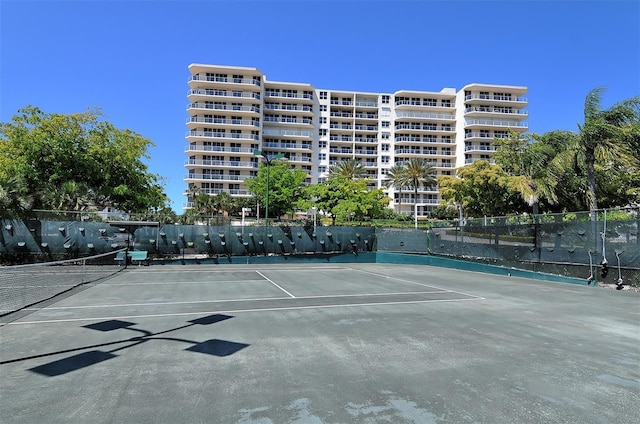 view of sport court with fence