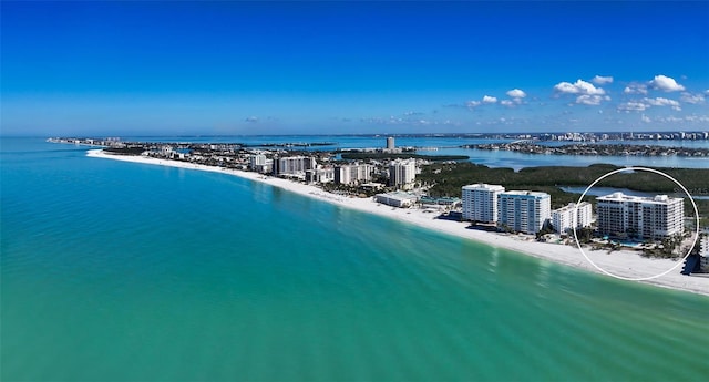 aerial view with a water view, a beach view, and a city view