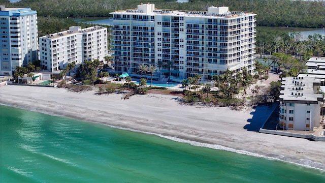 bird's eye view featuring a water view and a view of the beach