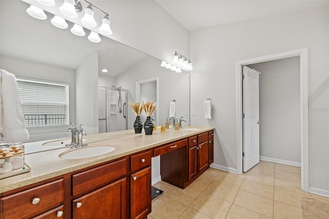 full bathroom with double vanity, a shower stall, a sink, and tile patterned floors