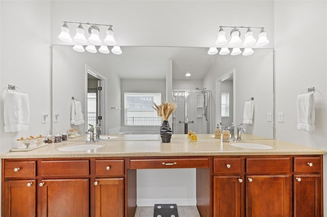 bathroom with double vanity, a sink, and a shower stall