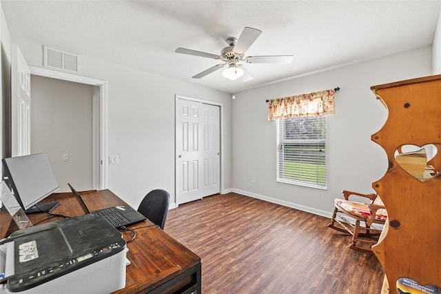 office area featuring ceiling fan, wood finished floors, visible vents, and baseboards