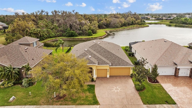 birds eye view of property with a water view