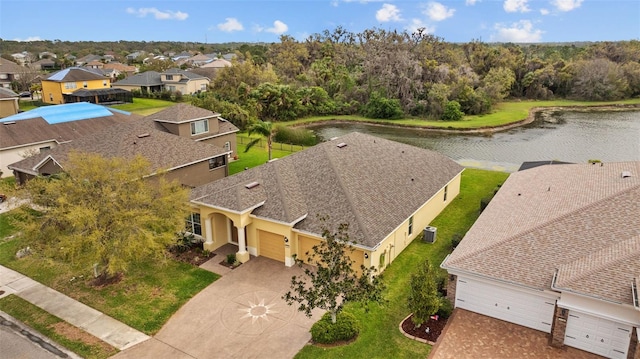 bird's eye view with a residential view and a water view