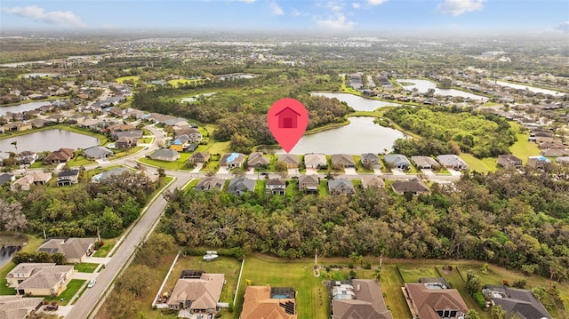 bird's eye view featuring a water view and a residential view