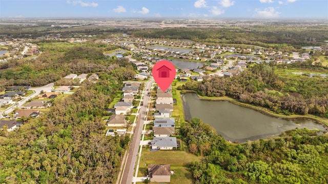 drone / aerial view with a residential view and a water view