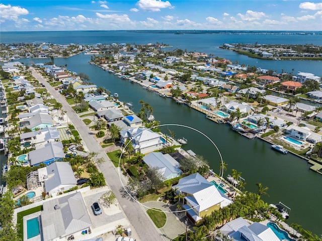 birds eye view of property with a residential view and a water view