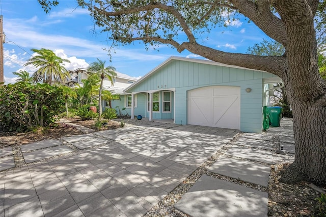 exterior space with an attached garage and concrete driveway