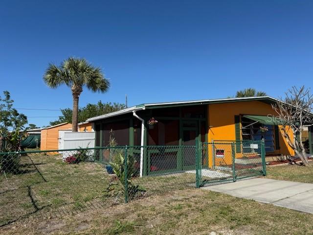 exterior space with fence and a gate