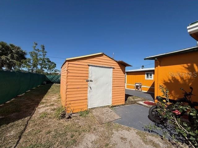 view of shed with a fenced backyard