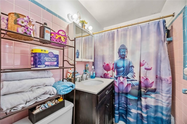 full bath featuring a shower with curtain, toilet, tile walls, and vanity