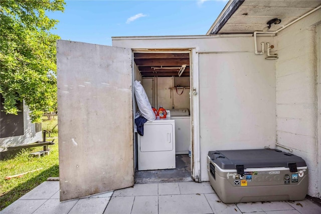 exterior space with washing machine and dryer and laundry area