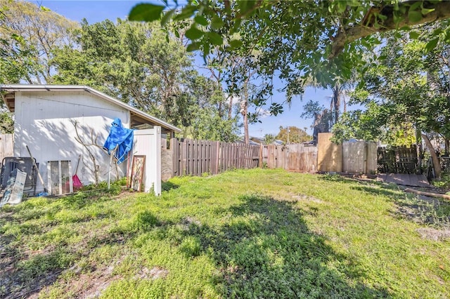 view of yard with a fenced backyard