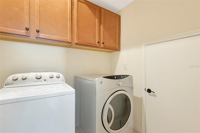 laundry area with cabinet space and washing machine and dryer