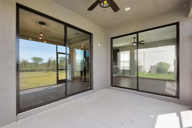 exterior space featuring ceiling fan