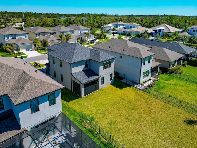 birds eye view of property with a residential view