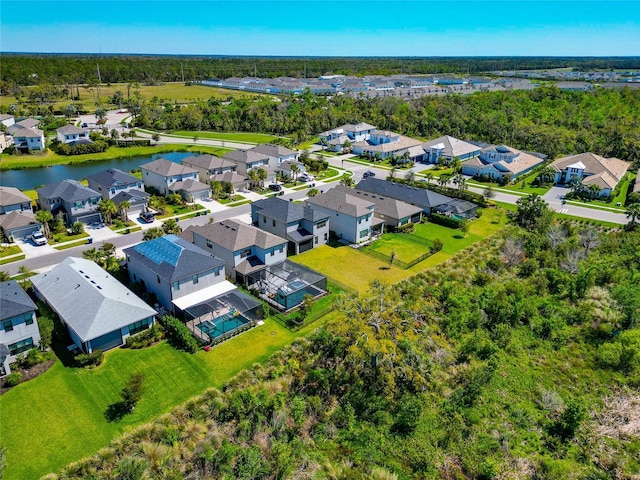 bird's eye view featuring a residential view and a water view