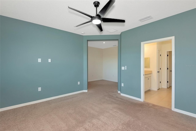 unfurnished bedroom with visible vents, light colored carpet, baseboards, and ceiling fan