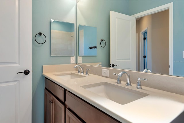 bathroom with a sink and double vanity