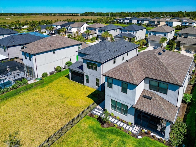 birds eye view of property with a residential view