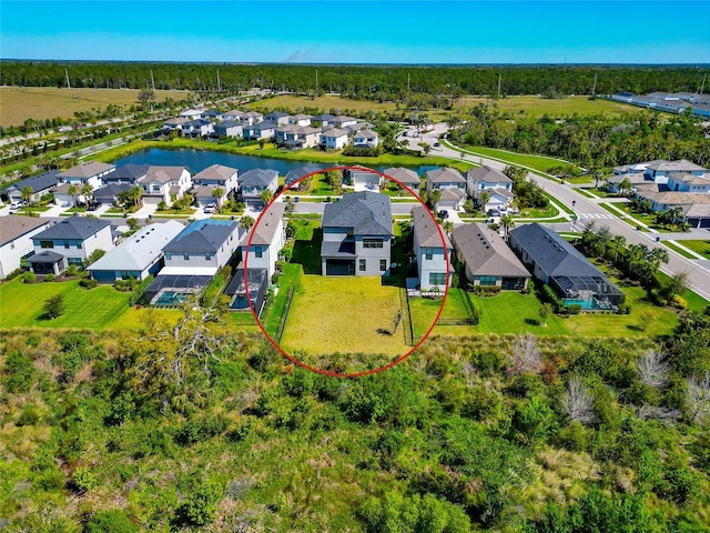 aerial view with a residential view and a water view