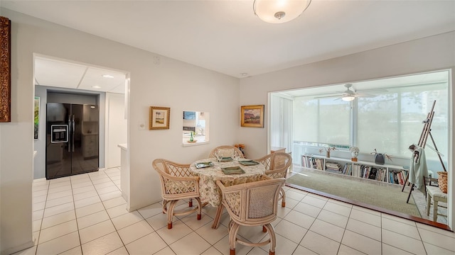 dining room featuring light tile patterned floors and a ceiling fan