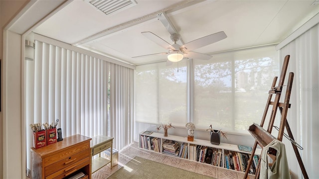 sunroom / solarium featuring visible vents, a healthy amount of sunlight, and ceiling fan