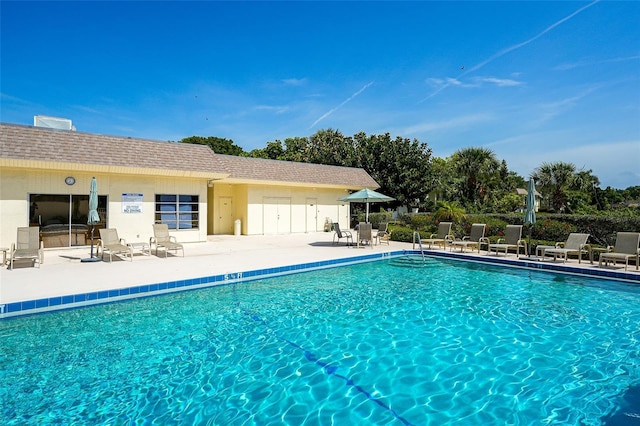 community pool featuring a patio area