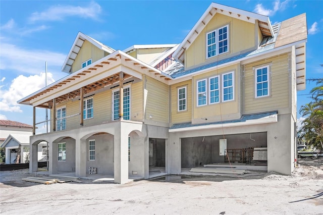 back of property with a balcony