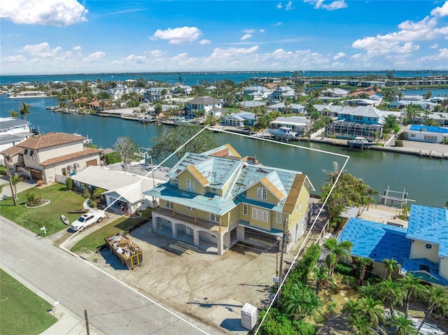 bird's eye view with a residential view and a water view