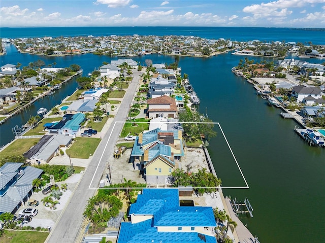 aerial view with a residential view and a water view