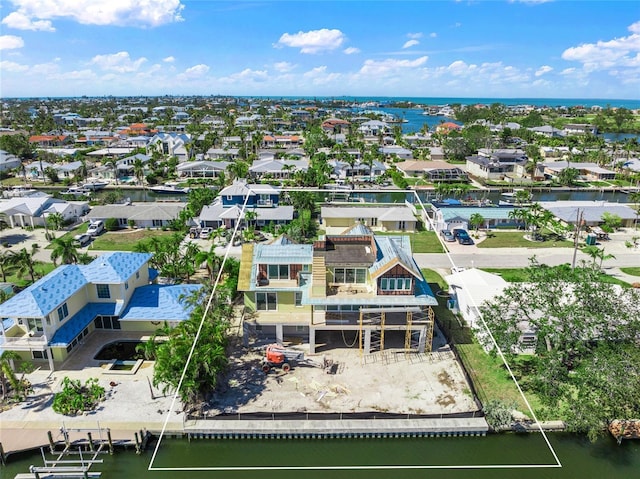 aerial view featuring a residential view and a water view