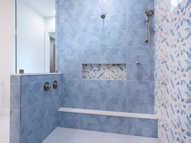 full bathroom featuring tiled shower