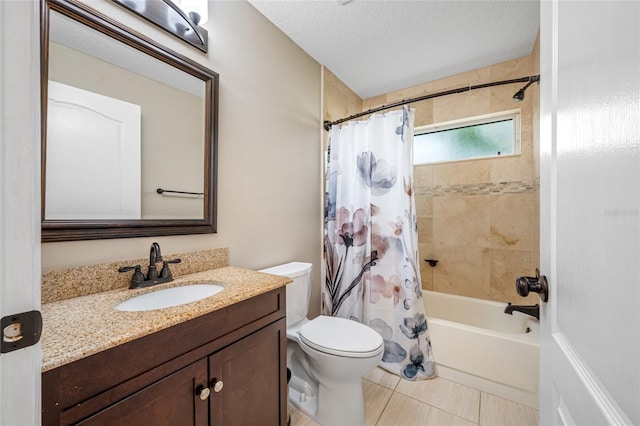 bathroom with toilet, tile patterned floors, shower / bath combination with curtain, vanity, and a textured ceiling