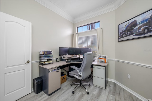 office area with ornamental molding, light wood-style flooring, and baseboards