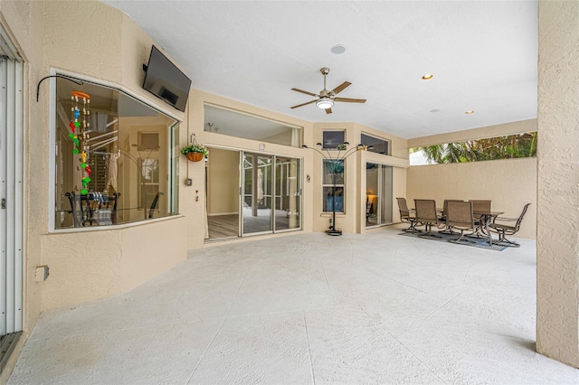 view of patio / terrace with outdoor dining space and ceiling fan