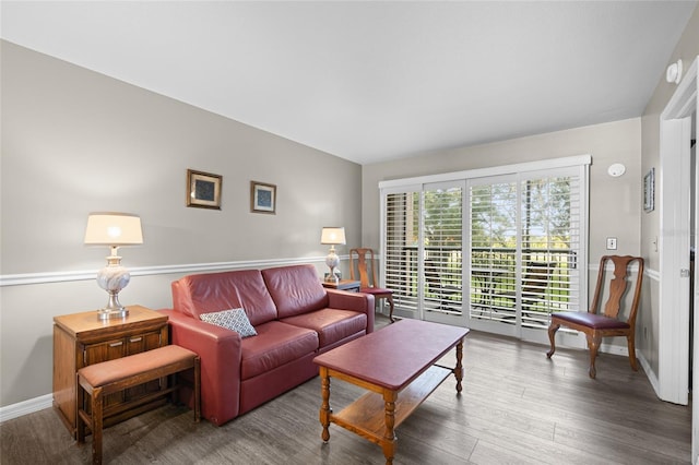 living room featuring baseboards and wood finished floors