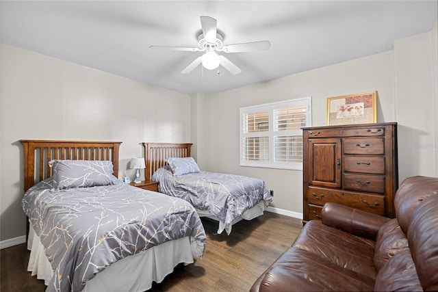 bedroom featuring a ceiling fan, baseboards, and wood finished floors