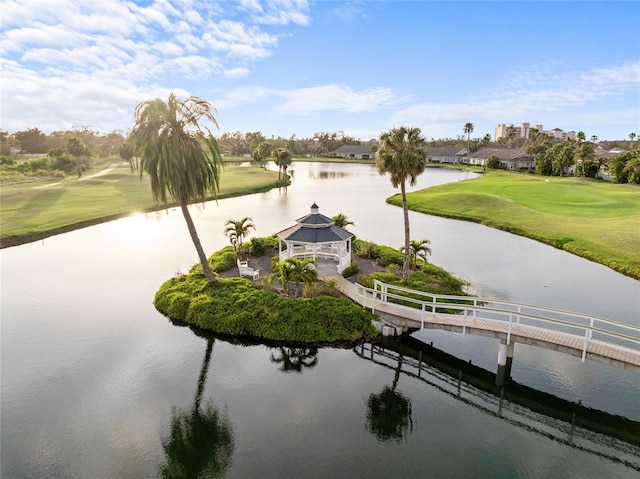 surrounding community with a gazebo, view of golf course, and a water view